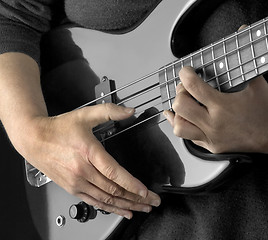 Image showing hand on bass guitar