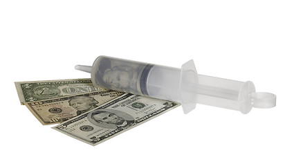 Image showing plastic syringe and dollar banknotes