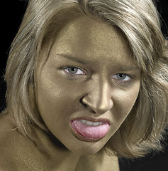 Image showing angry woman with golden face