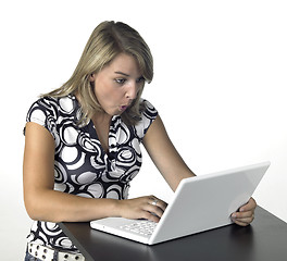 Image showing amazed blonde computing girl