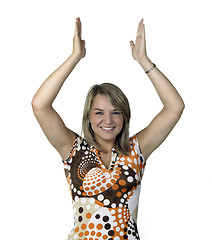 Image showing blond girl clapping her hands over head