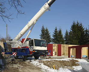 Image showing wooden house construction at winter time