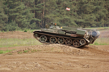 Image showing offroad scenery with driving tank