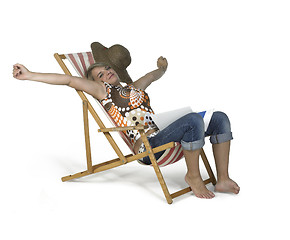 Image showing cute girl sprawling in a canvas chair