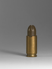 Image showing pistol ammunition in grey back