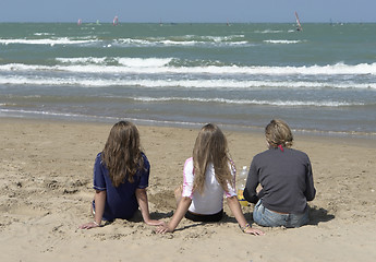 Image showing three kids at the sunny beach