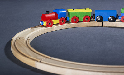 Image showing colorful wooden toy train on tracks