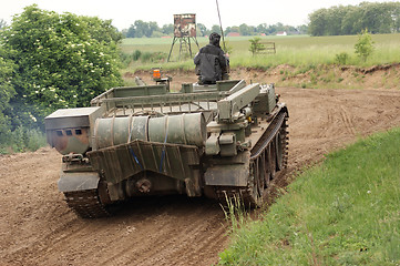 Image showing offroad scenery with driving tank