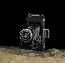 Image showing nostalgic camera on stone surface