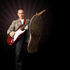 Image showing rocker with guitar and foot