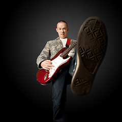 Image showing rocker with guitar and foot