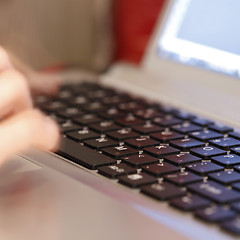 Image showing Young woman working on laptop