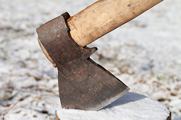 Image showing Axe in stump. Close-up view