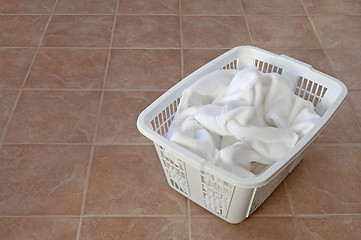 Image showing White towels in a laundry basket