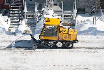 Image showing City street cleaned from snow by a snowplough