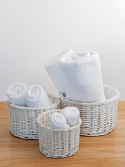 Image showing Clean towels in white wicker baskets