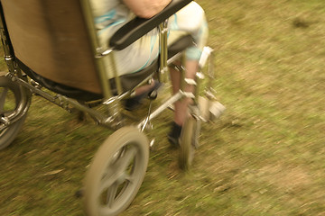 Image showing wheel chair in motion