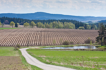 Image showing tractor plowing filed