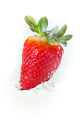 Image showing strawberry splashing into milk