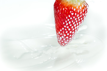 Image showing strawberry splashing into milk