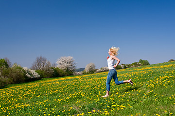 Image showing happy young woman on meadow