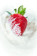 Image showing strawberry splashing into milk