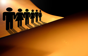 Image showing Living on the edge. People silhouettes on the the edge of the paper