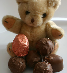 Image showing teddy has his favourite chocolates