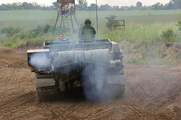 Image showing offroad scenery with driving tank