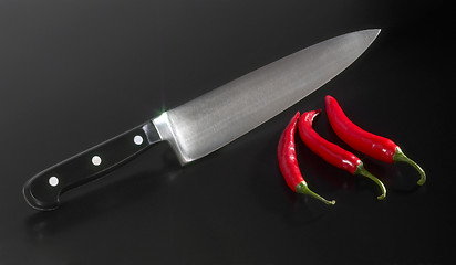 Image showing kitchen knife and chillies