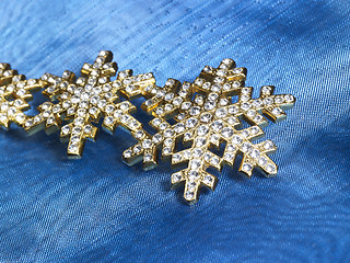 Image showing jewellery in blue fabrics background