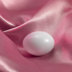 Image showing egg in pink satin fabrics