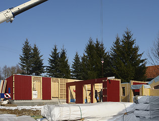 Image showing wooden house construction in sunny ambiance