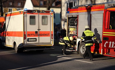 Image showing Ambulance and Firefighters