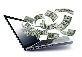 Image showing Money pouring out from a notebook computer