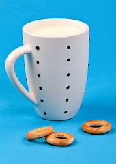 Image showing cupful of milk and bread rings