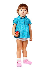Image showing little girl with an apple in studio isolated