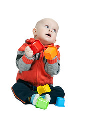 Image showing little boy with a plastic pyramid in the studio