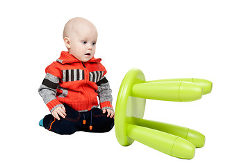 Image showing child dropped a plastic chair in the studio