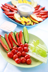 Image showing Raw vegetable and fruits with dip