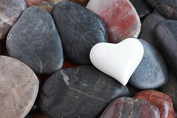 Image showing White heart surrounded by stones