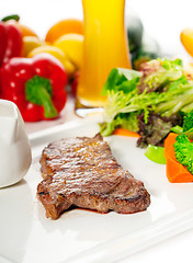 Image showing juicy BBQ grilled rib eye ,ribeye steak and vegetables