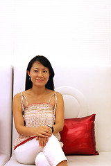 Image showing Korean woman on a white couch