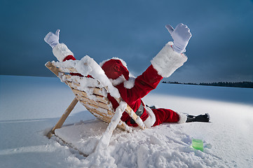 Image showing Santa relaxing on a sunbed