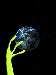 Image showing Alien Arm Grabbing The World 