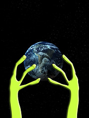 Image showing Alien Arm Grabbing The World 