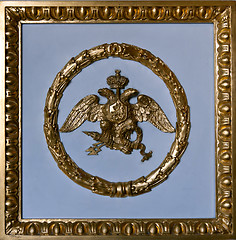 Image showing gold double eagle in a frame on a gray background.