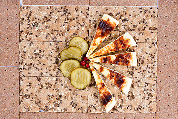 Image showing still life of bread, slices of pickles and cheese.