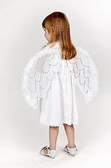 Image showing little girl with angel wings in the studio