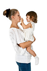 Image showing little girl at the hands of the mother feeds her and plum